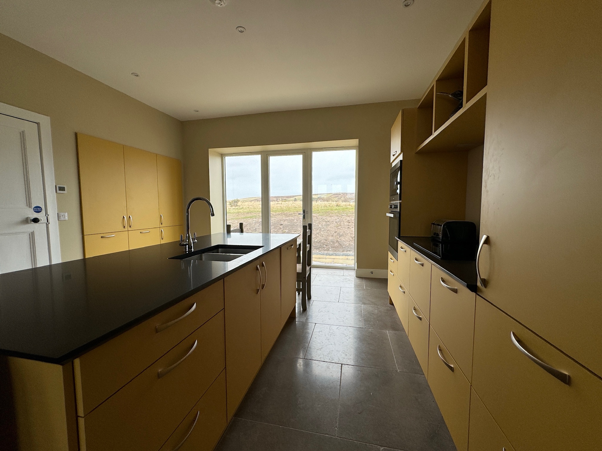 Kitchen island with black countertop